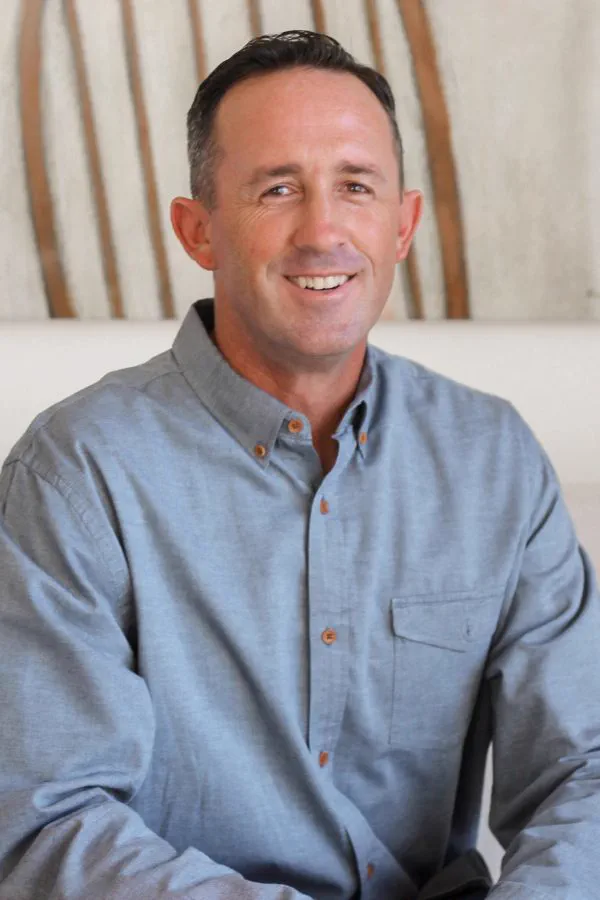 Portrait of Jordan Hatch, Partner / COO